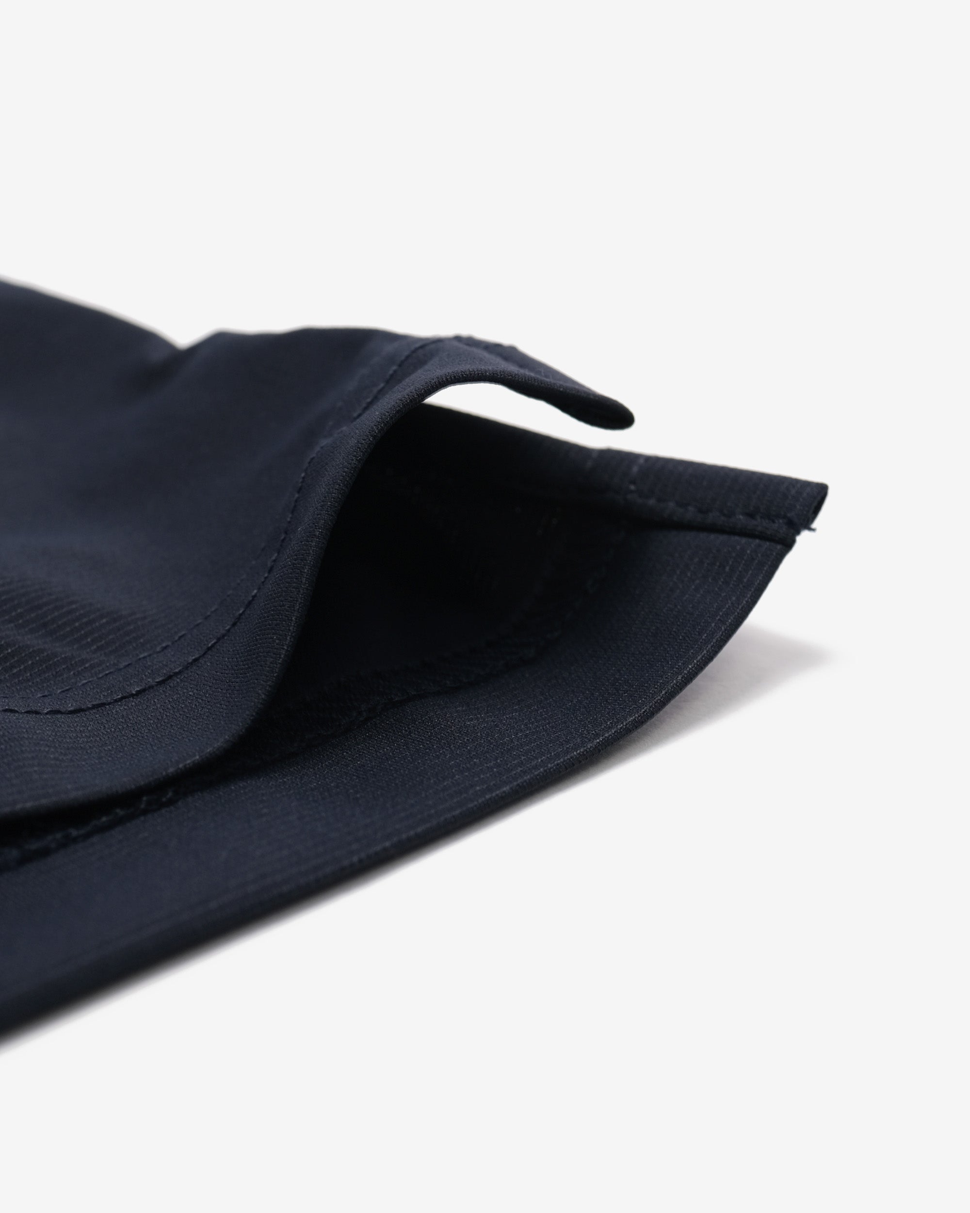 Navy blue bucket hat on a light gray background