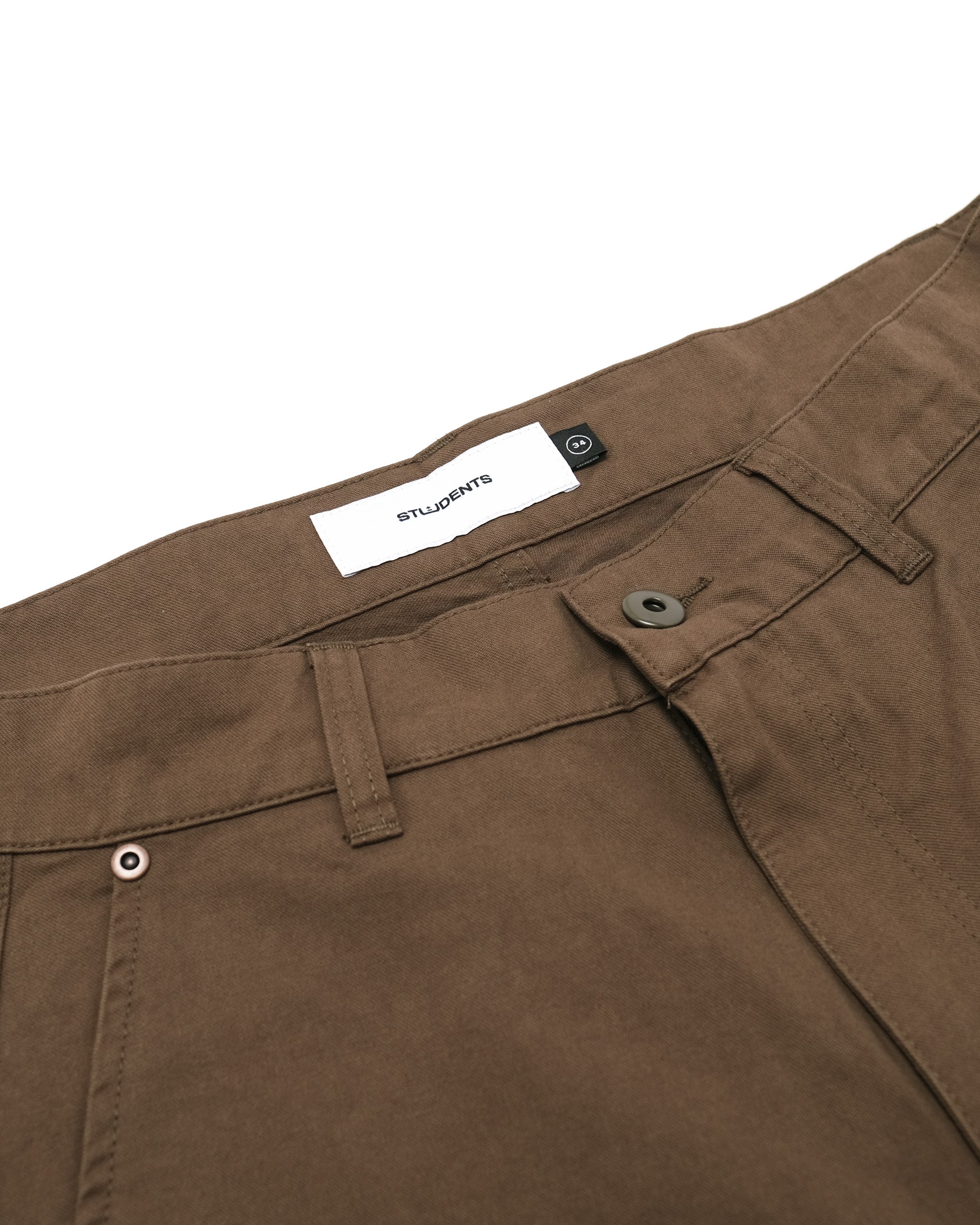 Brown pants with a brand label on a white background